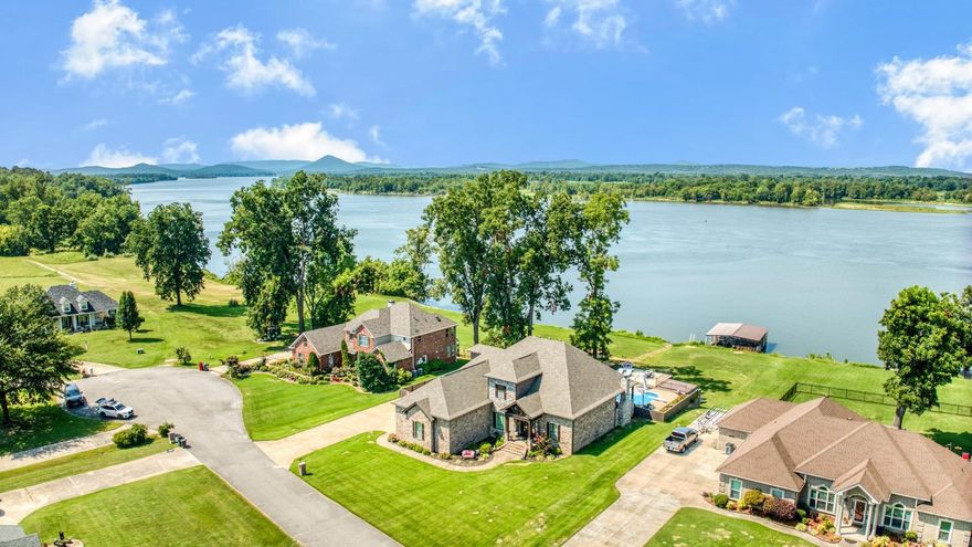 This spectacular 4 bedroom, 2.5 bath home was custom built and has all of the bells and whistles! It will be perfect for your large family with all of the space and storage it provides. You will love living on the Arkansas River with your pool, covered patio with outdoor kitchen, private boat dock, RV pad, 3 car garage, safe room, bonus rooms, geothermal HVAC system, large laundry room and so much more! Your evening sunsets over the river are amazing! WELCOME HOME!!