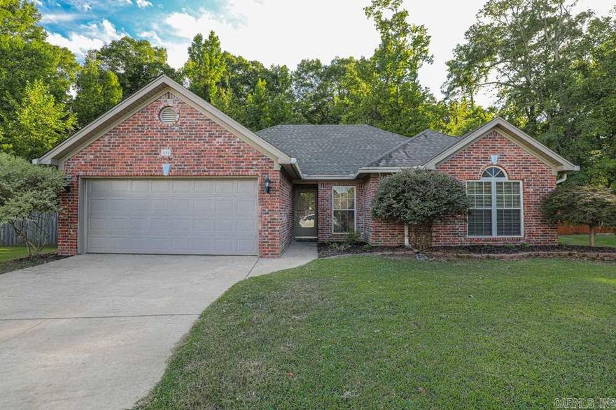 This well-maintained home is located in a peaceful cul-de-sac. It features a split-floor plan with a specious master bedroom.  The living room is cozy with a gas fireplace.  The kitchen contains stainless steel appliances & granite counter tops with stone-tiled back plash.  The two guest bedrooms are conveniently located to the living area & guest bathroom. The backyard contains a large patio area and backs up to woods for ultimate privacy.  Call today (870) 853-7673!