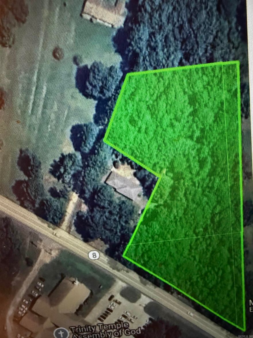 This wooded lot has road frontage along. Pine Street/Highway 8 and is a blank slate ready for the next business or home.  Located just outside the city limits it provides easy access to I-30 and is close to all conveniences. There are two parcels of land in this acreage and comes with a new survey as well.  Utilities are not on the property but are accessible from the highway. Call today for more details.