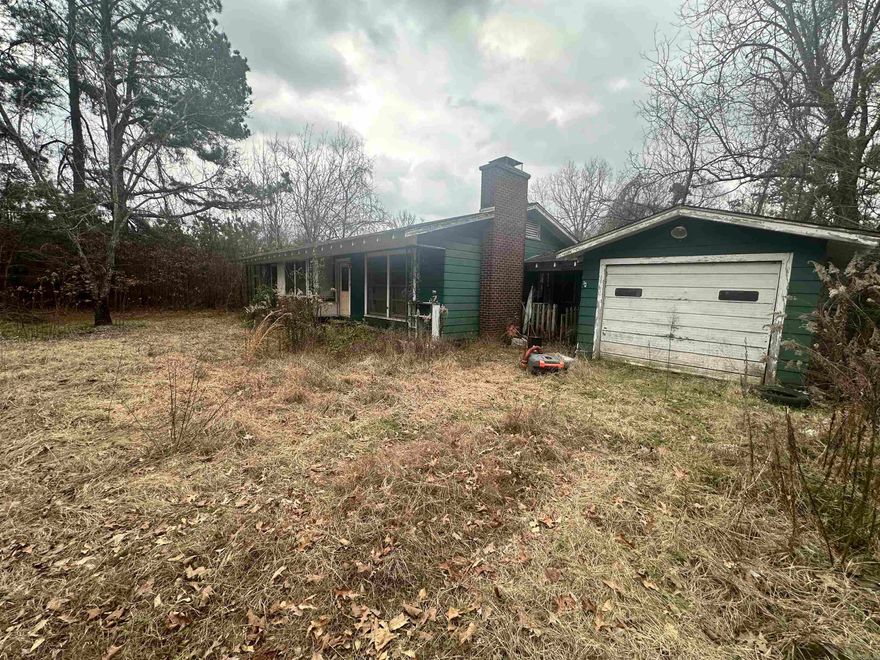 Discover the potential of country living with this charming 2-bedroom, 1.5-bathroom home nestled on a sprawling 6.12-acre lot. Ready to be transformed into your dream retreat, this property presents an exciting opportunity for those with a vision for renovation. With its serene surroundings and ample acreage, this home offers the perfect canvas for creating a peaceful sanctuary away from the hustle and bustle of city life. Whether you're seeking to reimagine the existing structure or build anew, the expansive land provides endless possibilities for expansion and customization. Embrace the opportunity to craft a rural oasis tailored to your unique lifestyle and aspirations. With its picturesque setting and untapped potential, this property invites you to embark on a journey of transformation and fulfillment. Don't miss your chance to make your mark on this idyllic slice of countryside paradise.