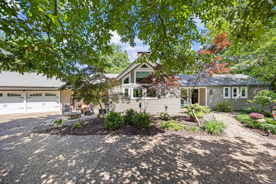 This pristine front yard sets the tone for your own private paradise. From the moment you step inside, the warmth and craftsmanship of this beautiful home are unmistakable. Floor-to-ceiling windows frame uninterrupted views, while soaring ceilings, exposed wood beams, and hardwood floors create an inviting, timeless atmosphere. The classic kitchen adds to the home’s enduring character, making every guest feel welcome.