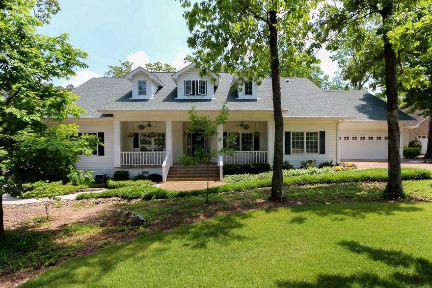 Stately, front porch, traditional home -  many updates. Beautiful golf lot overlooking large water hazard & green. Three bedroom plus study with custom cabinetry, 4 baths. Living room has vaulted ceilings, hardwood floors, gas log fireplace. 4 zone H/C, large kitchen with island, granite. Heat pump, roof, & hot water has been replaced. Large bonus room with full bath. House is wired for security. Huge garage plus room for golf cart and workshop. 2x6 construction - extra insulation & installed turbine vents.