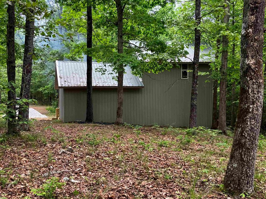 2 Bed 1 bath Cabin with creek on 13 acres.