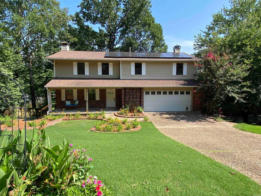 Updates at every turn in this 5 bedroom, 2 full, 2 half bath home.  new stone countertops and backsplash, prep sink, pantry, built-in china cabinets, wet bar with refrigerator, central vac, hardwood flooring, new carpet, fresh paint, double deck with gazebo, 2 fireplaces, zoned HVAC, 3 living areas, upstairs laundry, new lighting. Almost new solar system will be owned by buyer (paid in full by seller) with transferable 25 year warranty. August 2023 electric bill was $13.50.  Front porch swing is perfect for relaxing, ample space inside for entertaining. Perfect for multi-generational living.  Coveted school districts.  See agent remarks.