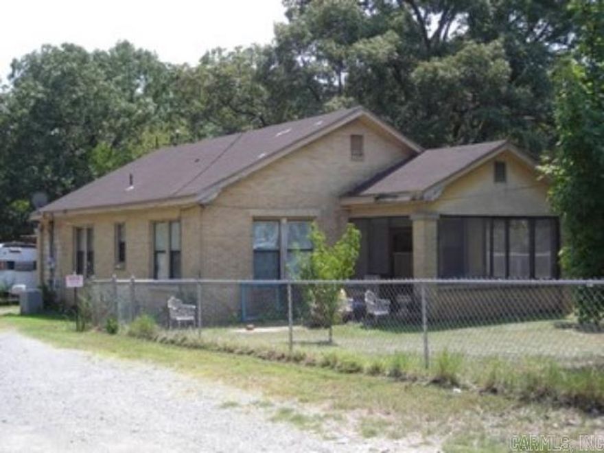 Residential lot in White Hall- home will need removed or renovated.