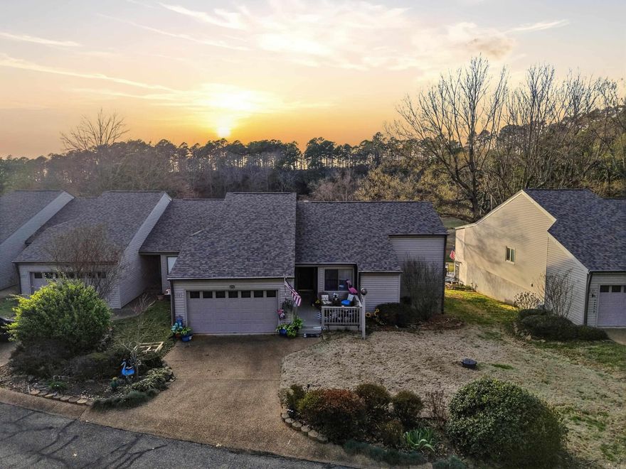 This townhome offers the perfect combination of comfort, convenience, and stunning golf course views. The open floor plan of the great room features beautiful hardwood flooring, a vaulted ceiling, and a cozy corner fireplace that creates a warm and inviting space for entertaining friends and family. Large windows frame the serene scenery of the 18th fairway and the expansive pond on Indian Hills Golf Course, making it easy to imagine relaxing with a good book while enjoying the peaceful setting. Step outside onto the spacious deck, a tranquil retreat perfect for morning coffee or evening gatherings while taking in the beautiful surroundings. Located at the end of the building, this unit offers added privacy along with a lower-level storage room or workshop—ideal for hobbies, projects, or additional storage. The garage also provides ample space for outdoor gear and equipment. This thoughtfully updated home includes a whole house generator for added peace of mind, luxury vinyl flooring, a modern kitchen, front and back decks, garage flooring, architectural shingle roof, updated doors, and a handicap-accessible master shower. With Greers Ferry Lake just minutes away. See Agent remarks