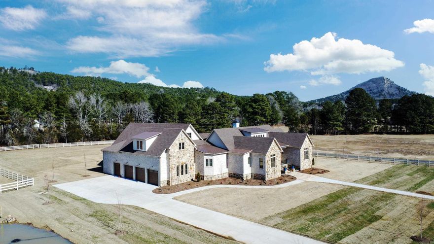 Check out the new neighborhood consisting of luxury homes on acreage with views of Pinnacle Mountain and minutes from Rattlesnake Ridge. Exceptional views, peaceful and serene surroundings. Lives like a retreat in the City on 2.1 acres. 20' ceilings in great room w/ beamed ceilings and fireplace. Chef's kitchen w/large dining space, quartz counter tops, gas cook top, double ovens, butler's pantry. Wine room, big game room w/ build-in's and a work-out room. Unbelievable outdoor space w/ eating and cooking area to take in the mountain view and enjoy the outdoor activities. Perfect yard to add a pool. Three car garage plus another garage for ATV, golf cart. All of this on one level. Floored attic space with enough room for another bedroom and bath. Truly magnificent home with too many detail to list! Call for more details! You won't want to miss this opportunity.