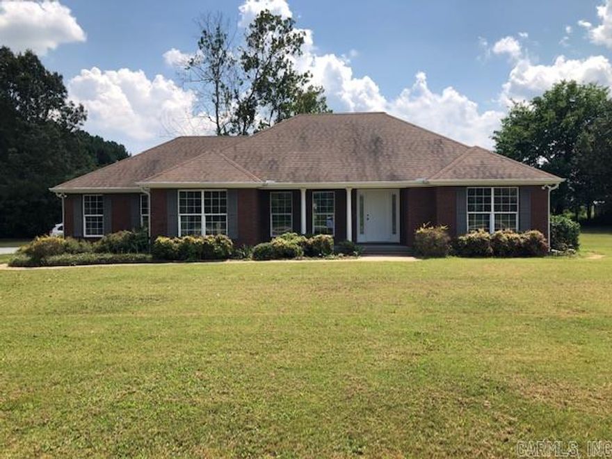 NEWLY REMODELED HOME ON 2.4 ACRES! This 1,768 square foot home sports 3 bedrooms, 2 bathrooms, breakfast nook, formal dining room, bar, living room and laundry room. Master suite has his and her closets, his and her vanities, gorgeous tub, separate shower and toilet closet. Home has been remodeled with new bathroom fixtures, new kitchen from floor to ceiling, new flooring, new paint, new cabinets, new counters, new light fixtures and too many new things to mention! Home has 3 car garages with one being used as an office. Sitting on a corner lot of 2.42 acres on a paved road with 10X10 outbuilding too! Must see to appreciate!