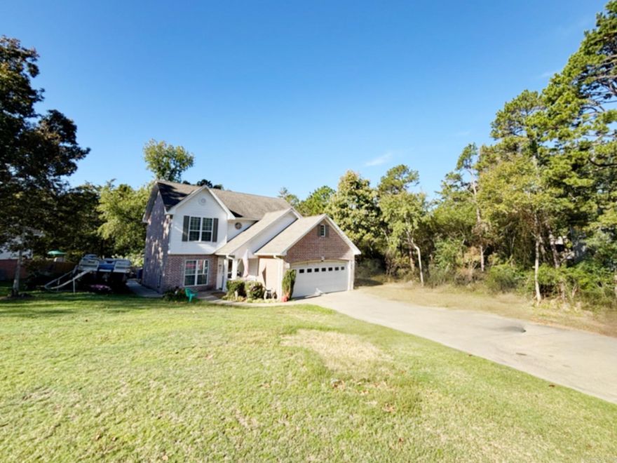 Acreage is approximate from the seller. This home has a lot to adore!! Two stories with a large deck in the back built around a large above ground pool that with a little love, will be ready for summer, two car garage, Gas log fireplace in a spacious family room, Tile showers in all 3 bathrooms with lots of storage throughout the home and an remote controlled lift up the staircase! Conveniently located in the heart of Heber Springs, close to the gorgeous Greers Ferry Lake, the Little Red River and everything Heber's Business district has to offer! Home is being sold as is. Agents see remarks