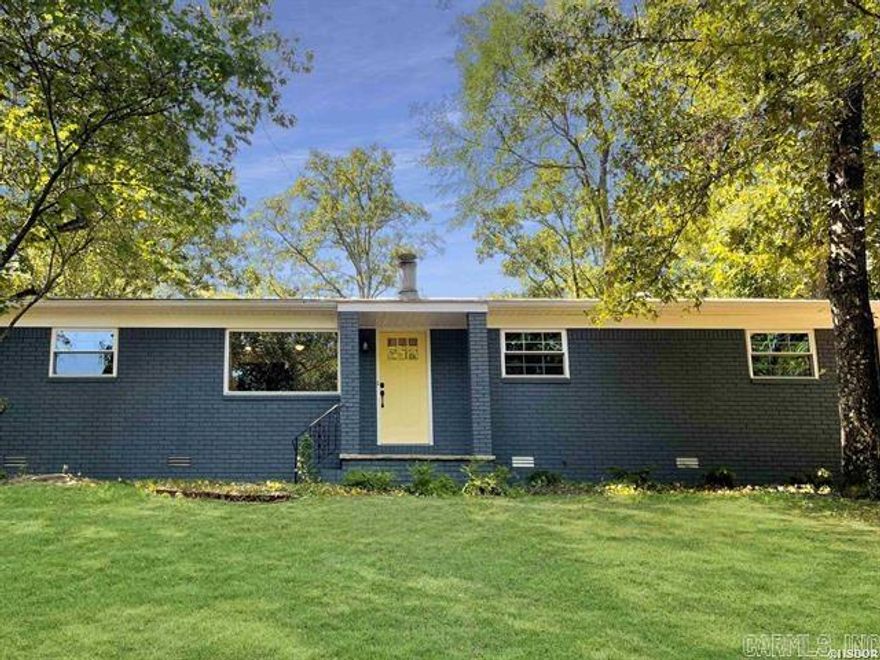 Nestled on a quiet tree-lined street in the desirable Charming Height subdivision, this charming 3 bedroom, 1.5 bathroom home boasts timeless character and modern updates. As you enter through the front door, you're greeted by warm laminate floors that flow through  main living spaces. To your right is a beautiful rock fireplace serving as the focal point. Imagine relaxing by the fire on a chilly evening(in the winter of course) or hosting movie nights with family and friends. Just beyond the living room is an updated kitchen with stainless steel appliances, soft close cabinetry doors, quartz countertops, and a tile backsplash. New windows allow sunlight to pour in and offer tranquil views of the expansive yard. The main bedroom includes .5 bathroom for added convenience. Two additional bedrooms share a nicely renovated full hallway bath. The yard features mature trees with lots of shade. The carport is large enough to be used as a carport & a nice patio area perfect for relaxing outdoors or hosting gatherings with friends and family. A brick storage shed provides space for yard tools and equipment. The home's thoughtful layout provides one-level living plus ample room space.