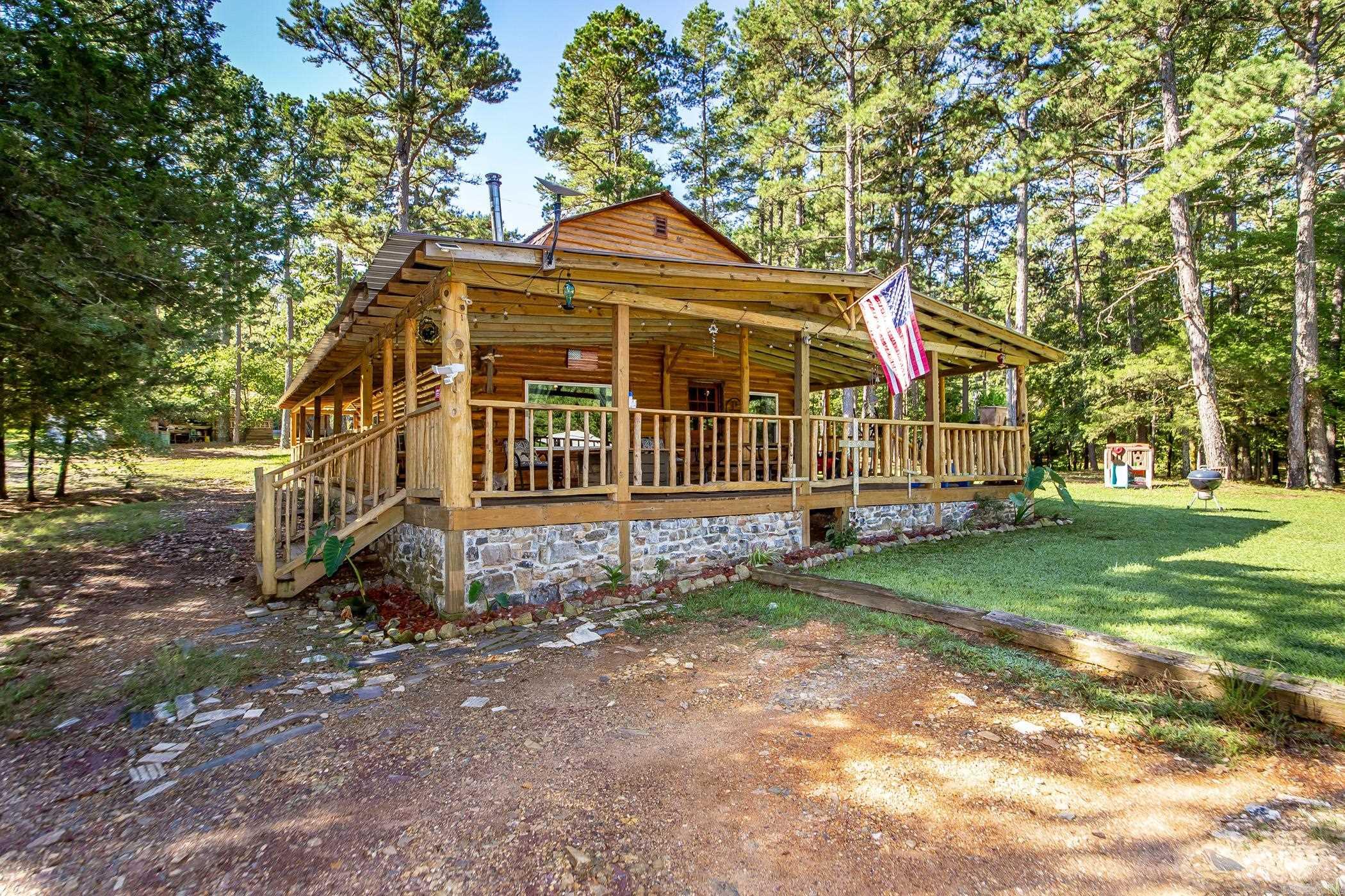 This 4-bedroom, 2-bath log cabin sits on 60 acres in the heart of the Ouachita National Forest, just 3 miles from the famous Wolf Pen Gap ATV trails. A spring-fed creek runs year-round through the middle of the property, while the national forest borders on three sides, offering privacy, adventure, and stunning natural views. The cabin blends rustic charm with modern improvements, including a new well pump and tank, septic updates, new gas lines, electrical upgrades, new windows, porch, and more. Multiple building sites provide opportunities for expansion, and a downstairs bedroom has been prepped with a dryer outlet for potential laundry or storage space. Whether youāre looking for a private retreat, full-time residence, or vacation rental investment, this rare property combines natural beauty with thoughtful updates in an unbeatable location.