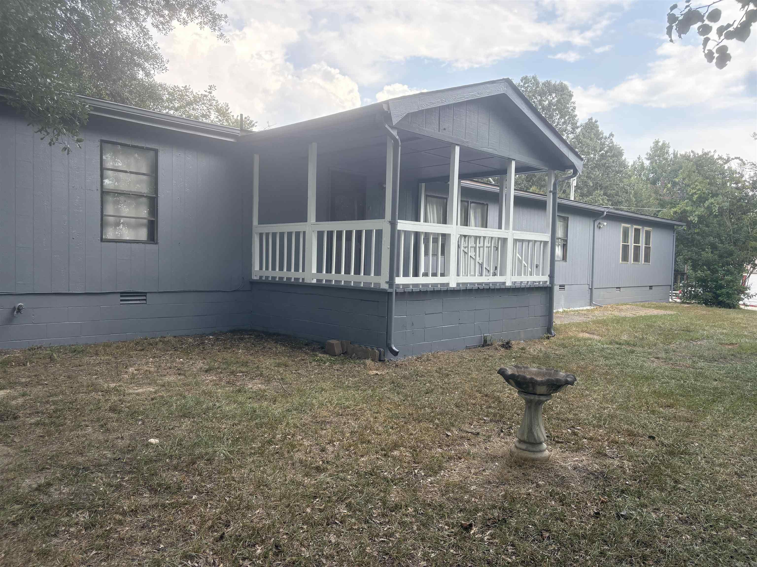 Located near Harmony Grove School District is this spacious home. Recently had renovation done to exterior of home and interior. It features an amazing gas fire place with a 1.64 acre front yard. There are two excellent storage spaces and a back deck behind the house.