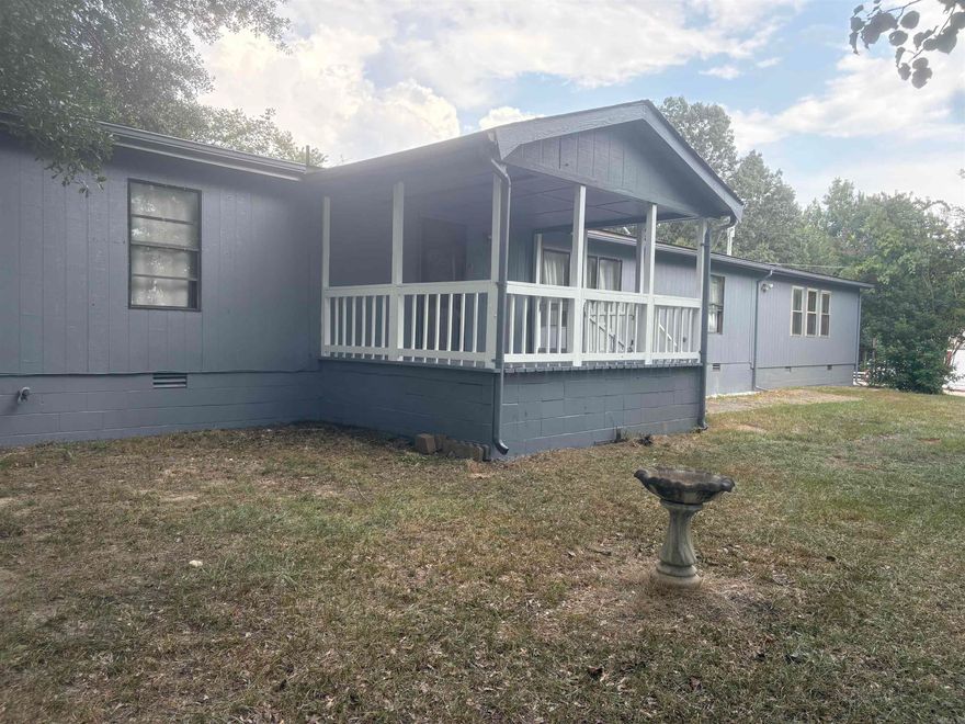 Located near Harmony Grove School District is this spacious home. Recently had renovation done to exterior of home and interior. It features an amazing gas fire place with a 1.64 acre front yard. There are two excellent storage spaces and a back deck behind the house.