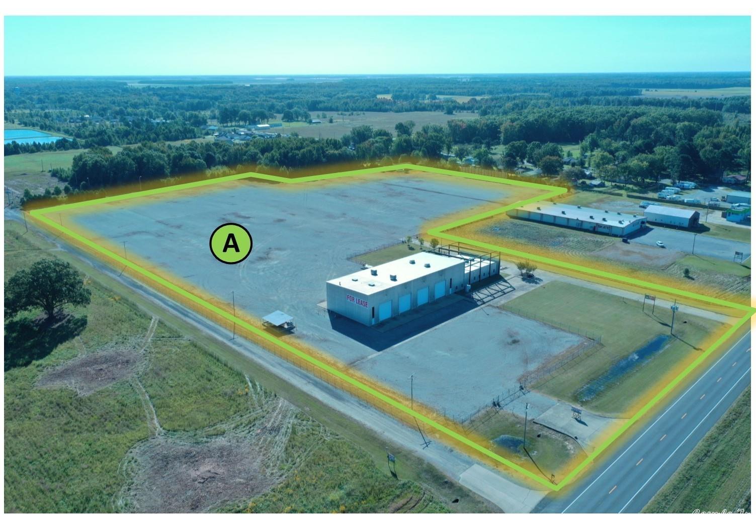 The building has 15,162 SF with 19 fenced in acres. The site has two gated entrances, Eight (8) grade level roll-up doors, stabilized gravel, curbed & paved driveways and parking areas. The site is fully fenced with heavy power, automated gates, yard lighting throughout. One 20-ton overhead bridge crane, Two 5-ton jib cranes inside the shop.