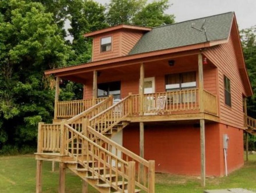 02308-?? Riverfront Paradise in Calico Rock, Arkansas! ??Escape to your dream retreat along the serene White River in the picturesque town of Calico Rock, Arkansas. Nestled within nature's embrace, this captivating riverfront cabin offers an exquisite blend of tranquility and comfort. Whether you're seeking a peaceful weekend getaway, an investment opportunity, or a permanent residence, this gem has it all! ?? Cabin Highlights ?? ? Fully furnished, ready for you to move in and start enjoying! ? Two spacious bedrooms for ultimate relaxation. ? Pamper yourself in the luxurious half bath, plus a full bathroom for convenience. ? Modern amenities including a washer and dryer for your comfort. ? Effortless meal prep with a fully equipped kitchen featuring a dishwasher. ? Sip your morning coffee or watch the sunset on the front and back porches. ? Create lasting memories around the fire pit, perfect for storytelling and s'mores! ?? Investor's Dream ?? This gem isn't just a cabin; it's an opportunity! Already established as a successful  (VRBO), you can capitalize on the booming vacation rental market. All for $335,000