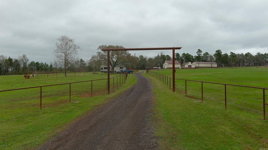 This 120-acre property is set up and ready to go whether you're building a home, running cattle, or keeping horses. The land offers a strong mix of pasture and cover, with a creek along the west end that provides water and draws in wildlife, making it just as appealing for hunting as it is for livestock. Utilities are already in place with a drilled well, hand-dug well, and municipal water, giving you flexibility and reliability. There are two septic systems, one at a previous homesite with an RV hookup and another for the shop, along with two total RV hookups for living on-site or hosting. The property features a 40x40 shop with electric, bathroom, washer and dryer hookups, and propane for a backup generator, a 35x35 horse barn with five stalls and a tack room, and an 80x30 equipment shed. New barbed wire and pipe fencing make it ready for livestock, all just a short drive from Mount Magazine and Petit Jean Mountain.