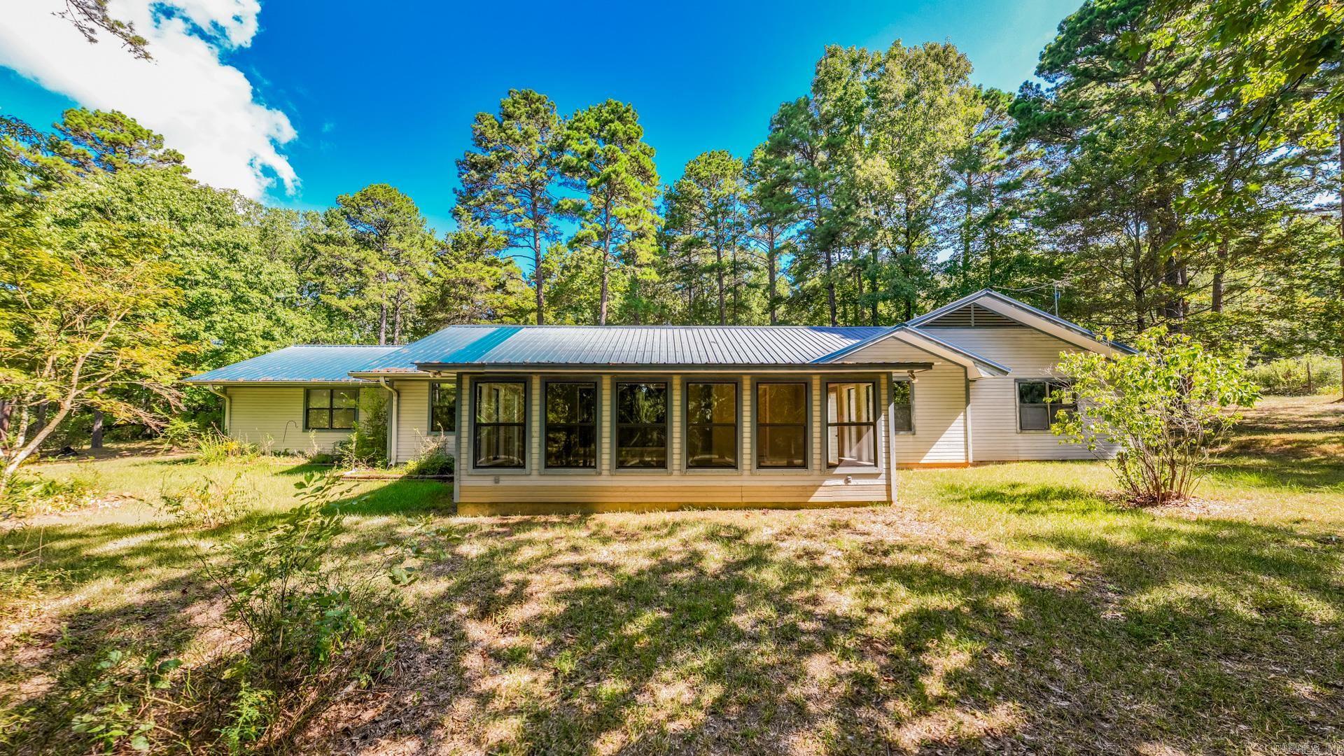 Hard to find hidden oasis. This nice property is secluded but minutes to schools and shopping. Large home with room for everyone. Huge sunroom/mutli purpose room. Must see to apprecaiate all this lovely property has to offer. Large shop with electricity and plumbing. Beautiful mature trees all on 2.68 acres