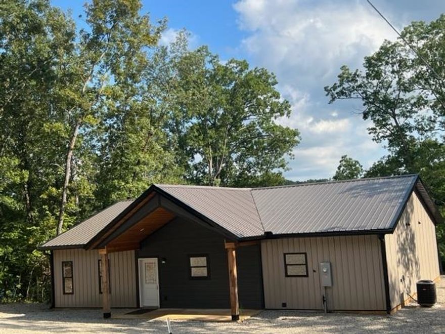 Lake Sherwood  NEW CONSTRUCTION4 bedroom, 3 1/2 bath lake front home! Move in ready. Located on this 110 acre spring fed lake. Home features all bedrooms & baths, laundry room and a 'Wow factor' tong & grove vaulted great room-- all on one level-with 2 hvac units & 2 hot water heaters. The master bedroom has a great lakeview &  features walk-in shower, double vanity. The great room/kitchen offers a 12 ft. island with built in cabinets with seating for 6-8 people on other side. There is an extra bonus area for a pantry or office area. The laundry room is large enough for cleaning items or pantry shelves.  It has a covered generous deck overlooking the lake nestled among the wooded surroundings on a paved road.  This is a unique home in a private lake setting.  Enjoy, skiing, pontoon, swimming, fishing, kayaking, paddle boarding. Private, but, golf cart or side by side distance to downtown Hardy & Spring River.