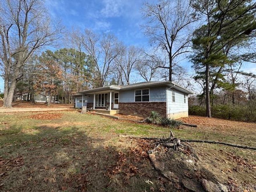 Located close to Lake and River Access. This cute home is sitting on two lots on a dead end street in Lakeview, Ar. You will love the size of the yard and the charm of this home! Call today to schedule a look.
