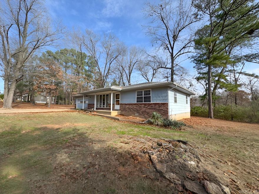 Located close to Lake and River Access. This cute home is sitting on two lots on a dead end street in Lakeview, Ar. You will love the size of the yard and the charm of this home! Call today to schedule a look.