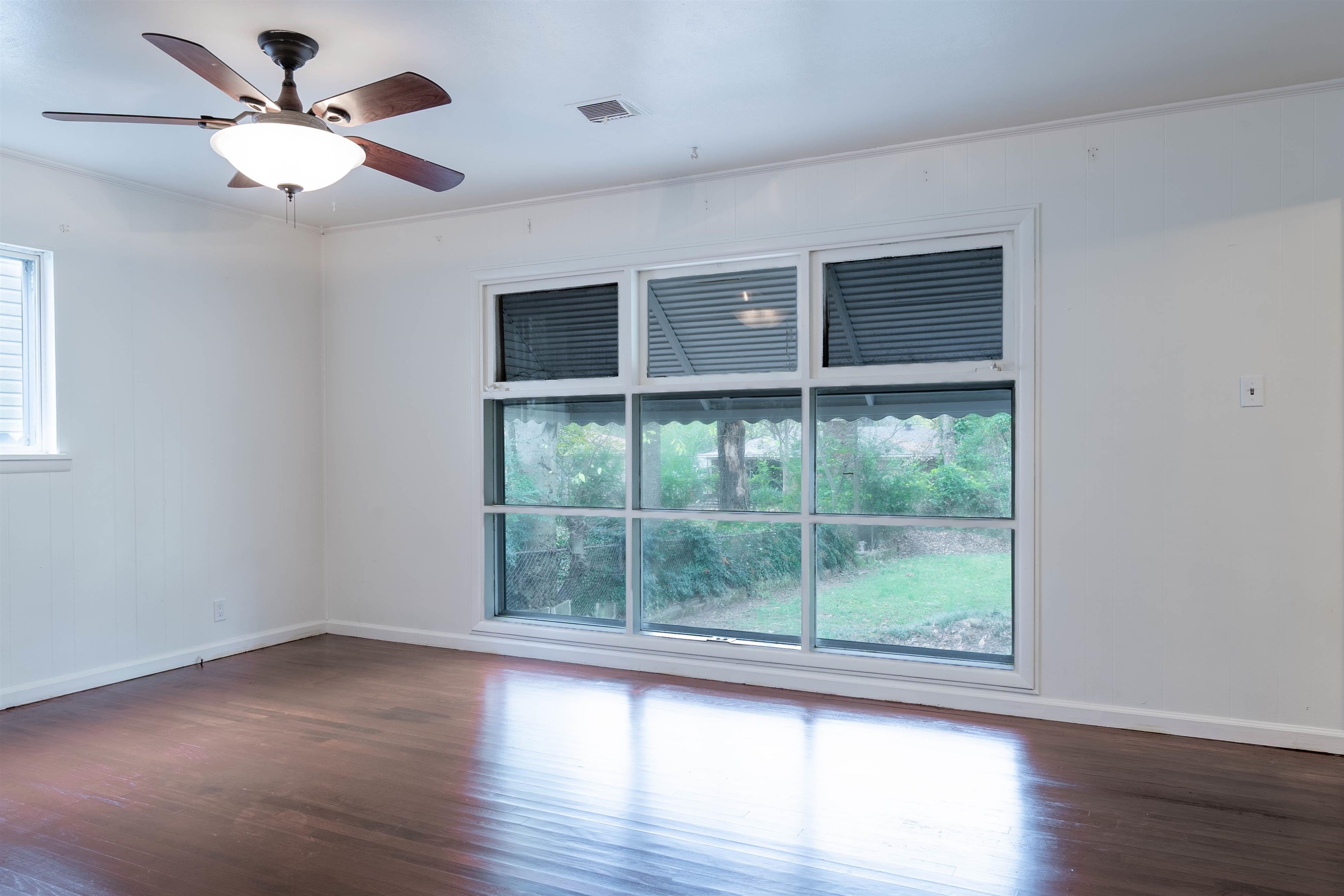 **3 Bed, 1 Bath** home with hardwood floors throughout **Spacious, fully fenced backyard** with an **8x10 wooden storage shed** **Ceiling fans in every room** for added comfort *Covered carport** with **dual gated backyard entry** (includes double-wide access gate) **Washer & dryer included** in the sale **New hot water tank** & **roof in great condition**!