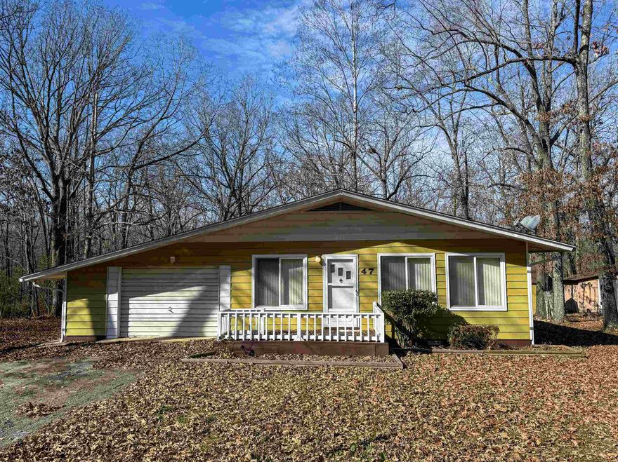 Located along Summit Ridge Lane in Ozark Acres, this 2-bedroom, 1-bath home offers approximately 1,000 sq ft of living space on two lots totaling about 0.84 acres. The floor plan includes a cozy living area, an efficient kitchen layout, and a full bathroom with double sinks, a jetted tub, and a walk-in shower. A Florida room/sunroom off the garage provides additional flexible space for storage, projects, or seasonal use.  Outside, the property includes three outbuildings that offer a variety of storage options for tools, equipment, or recreational items. With paint, flooring, and general interior updating, the home can be refreshed to suit a variety of needs.  Home is being sold as part of an estate, and sale will require judge approval.