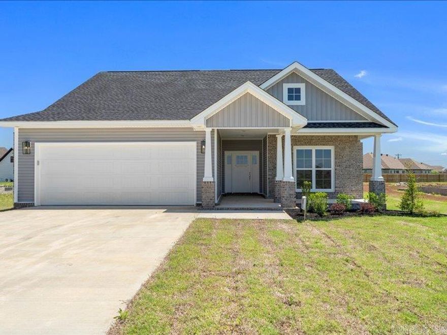 lNEW CONSTRUCTION in Manila, Arkansasthis Craftsman home offers a small town vibe but so close to city life and to the steel mills in Mississippi County that offer the WORK HERE LIVE HERE Program!  Open living/dining/kitchen area with tons of natural sunlight, luxury vinyl plank flooring, electric fireplace, island, stainless appliances, granite countertops, white shaker cabinets, pantry, laundry room.  Master bedroom has vaulted ceiling, more natural sunlight and access to the covered porch in the back.  Master bath has double vanity, walk in tiled shower, soaking tub and private water closet.  There are 2 more bedrooms and another full bath.  Double garage, covered porch and nice back yard.  Color scheme is light, airy and modern. We would love to show you this home and give you details on the Work Here Live Here program.