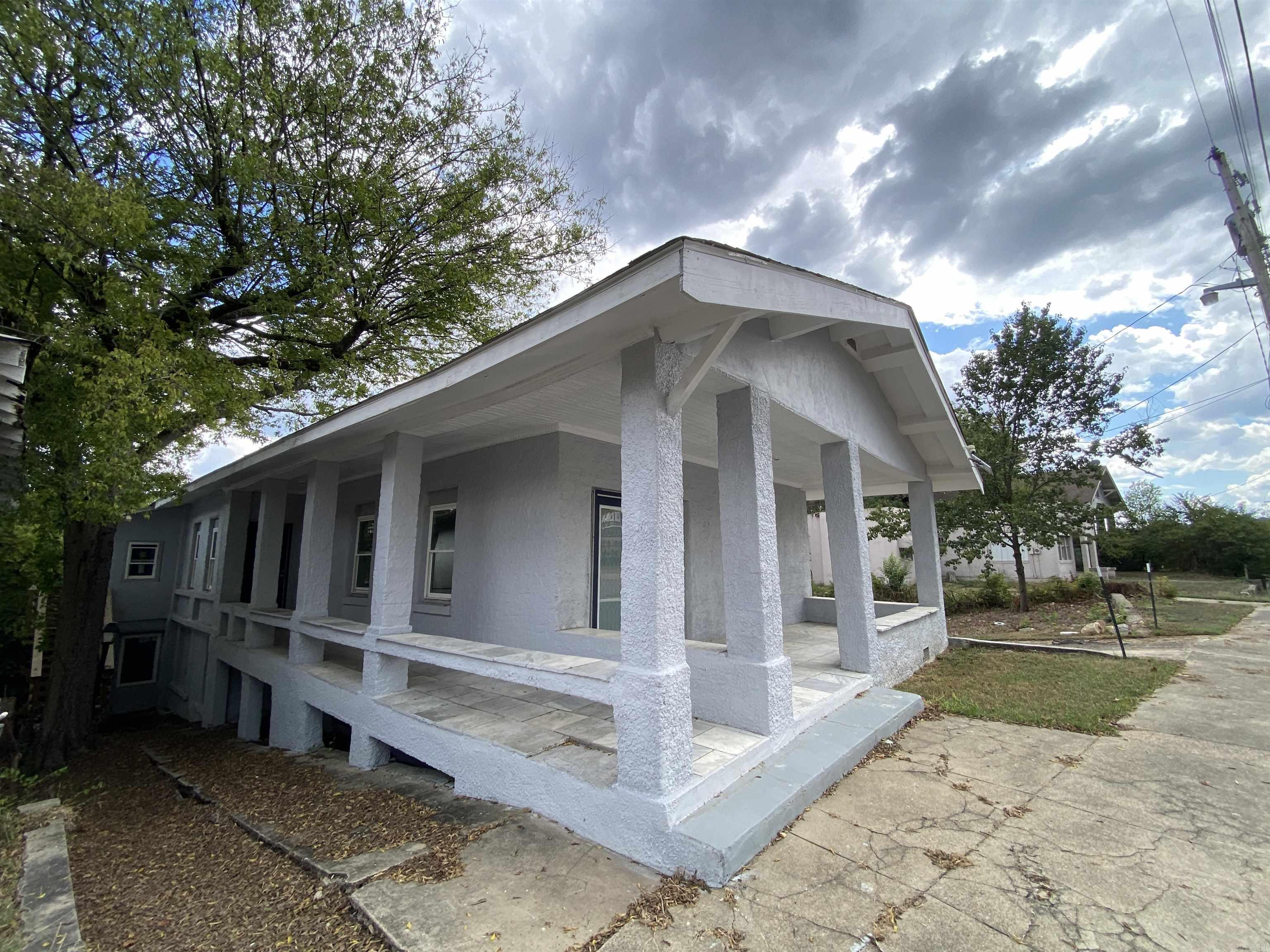 Enjoy beautiful views of the Hot Springs skyline from this 1930 duplex within walking distance of Bathhouse Row. Once a five-plex, This great build was converted to two huge units due to sprinkler system regulations in Hot Springs. The exterior has a new roof, new windows, new doors, and new paint. The upper unit is a 1536 sq' with 4 bedrooms and 3 baths. The lower unit is 1008 sq' and ready to be whatever you can dream of. Great access to Historic Hot Springs, Farmers market, bus route, Hot Springs Greenway Trails, and dining.