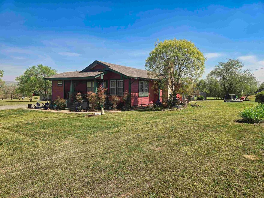 Located among the rolling foothills of the Ozark Mountains, traffic through Clinton is consistent year-round. Highway 65 is the entry to all the outdoor activities one could imagine they might find in The Natural State - fishing, boating, hiking, floating, art & folk music.   The house, built in 1932, is a charmer with original hardwood floors & 8-inch baseboards.  It offers 3 bedrooms and 2 full bathrooms in 1262 square feet that would be great as living or office space! The fully insulated garage was recently rewired and is divided into 3 distinct sections: an oversized 2-car garage, a large workspace perfect for woodworking or restoring/refinishing furniture and a storage room.  This property has the potential to be used as office space, a thrift/antique storefront, a photography studio - or even use the back field to create your very own market! Over the past couple of years, the seller has hosted his own very successful markets and grown a clientele for his restored antiques and other creations from Little Rock to Missouri and beyond!   Take advantage of the est 12,000 - 14,000 vehicles traveling through Clinton on highway 65 each day (according to ARDOTs AADT patterns).