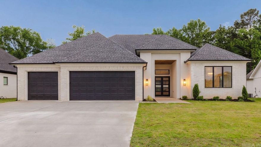 Tucked away on a quiet street in the amenity-filled Hurricane Lake Estates, this home is a custom dream. The double doors welcome you into a beautiful living room with a vaulted ceiling, cozy fireplace, and numerous windows that bring in the lush green space outdoors. The home chef will never want to leave the kitchen, which features gorgeous lighting, numerous custom cabinets, a dual refrigerator/freezer, and a large hidden pantry. A built-in wet bar serves as a seamless transition from the living room to the kitchen. Together with the eat-in dining area, it’s perfect for entertaining. The spacious primary suite also has a vaulted ceiling and opens into a stunning spa-like bathroom with his and hers vanities and closets, a walk-in shower with freestanding tub, and unique under-cabinet lighting. A perfectly designed split floor plan places three additional bedrooms and two bathrooms on the opposite side of the home. Adding convenience, the heating/cooling system operates on two zones so each side of the home can adjust to their own comfort. Rounding out this stunning property is a covered patio with an outdoor wood-burning fireplace, a sprinkler system, and floored attic storage.
