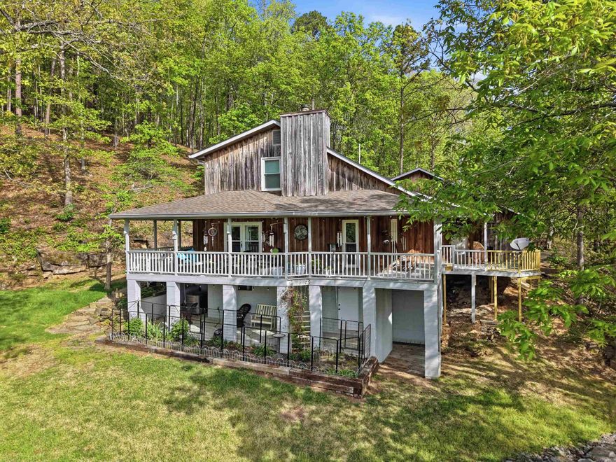 Seller has been original owner since she had the home built in 1991. Cypress Siding (no staining needed, she's only had to pressure wash occasionally). Home is on city water, has backup on demand Generator (under deck), New Furnace installed about 5 years ago & there are geothermal lines that work for heating & cooling located near propane tank (See agent remarks on how that works), Electric water heater, dryer (gas), stove (gas), Wood burning stove fireplace, New Architectural Roof installed by Stephen Ganus about 7 years ago , all new windows installed by Wilson's Windows, & Concrete Boat Ramp located at the end of Leech Rd. (just a short walk from the house) and ramp located in the back of Greers Ferry Lake. Wrap around deck on the backside of home overlooks the lake & seller has plenty of birds & wildlife that comes around with this being tucked into the mountain & surrounded by woods. Basement Area is heated & cooled and could be finished out for more living space. (Sqft. TBD, waiting for measurements from appraiser). See "virtual tour website" for the house layout and video of the property