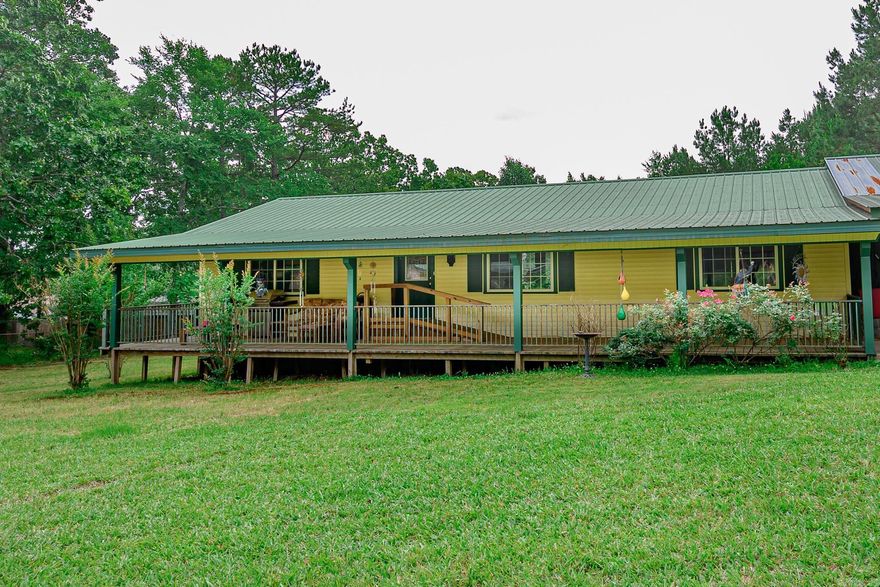 Home nestled just on the out skirts of Mena in private location. Come home to the country two minutes from Post Office, Hospital, Shopping just off of paved road. Three bedroom two full bath home, spacious living area with large windows, kitchen with side dining area offering patio doors to overlook back yard and deck area. Home has full covered porch and deck, attached oversized carport, large shop.  Close to Ouachita Mountain, ATV trails, bike trails, creeks, rivers.