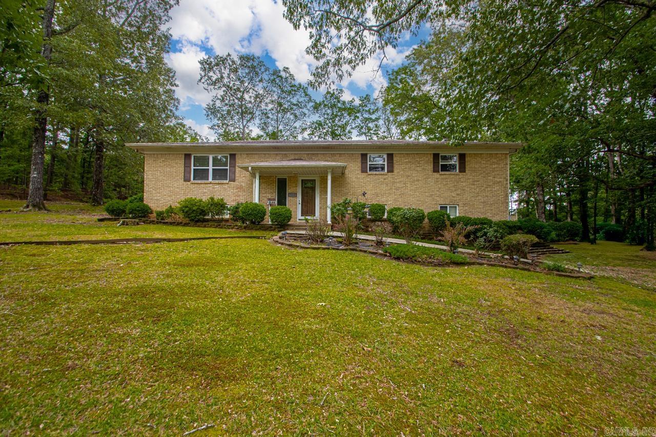 Welcome to this spacious tri-level home that is full of possibilities! Upstairs has a good sized family room, open eat-in kitchen, 3 bedrooms and 2 full baths. In the kitchen, the refrigerator will convey, dishwasher replaced in 2025, oven & microwave replaced in 2022. Owner has added extra cabinets for storage that will convey. Downstairs has a large bonus room, an office (can be used as 4th BR), half-bath and laundry room. Hot water tank was replaced in 2025. Roof was replaced in 2020. This home sits on almost 1 acre with a fully fenced backyard. There is also a 2-car carport and barn on the property. The barn has been updated with electricity, heat/air (window unit & portable AC) & newly built stairs to the loft. Owners also added a new large window & double door. The deck was also repaired in 2024.