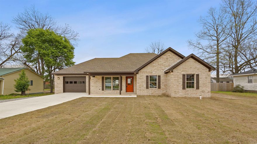 Welcome to this stunning full brick home with 3 bedrooms and 2 bathrooms. As you enter, you'll immediately notice the seamless flow between the living room and kitchen, creating the perfect space for entertaining or relaxing with loved ones. A private laundry room adds convenience and functionality to your daily routine. Plus, with a large storage area in the garage, you'll have plenty of space to store all your belongings. Step outside and enjoy the beautiful covered front porch or retreat to the covered back patio for a peaceful moment outdoors. This home will be finished with exquisite details including White Dove paint, luxurious LVP flooring, stainless steel kitchen appliances, and custom cabinetry adorned with elegant nickel finishes. Don't miss your chance to call this house your home.