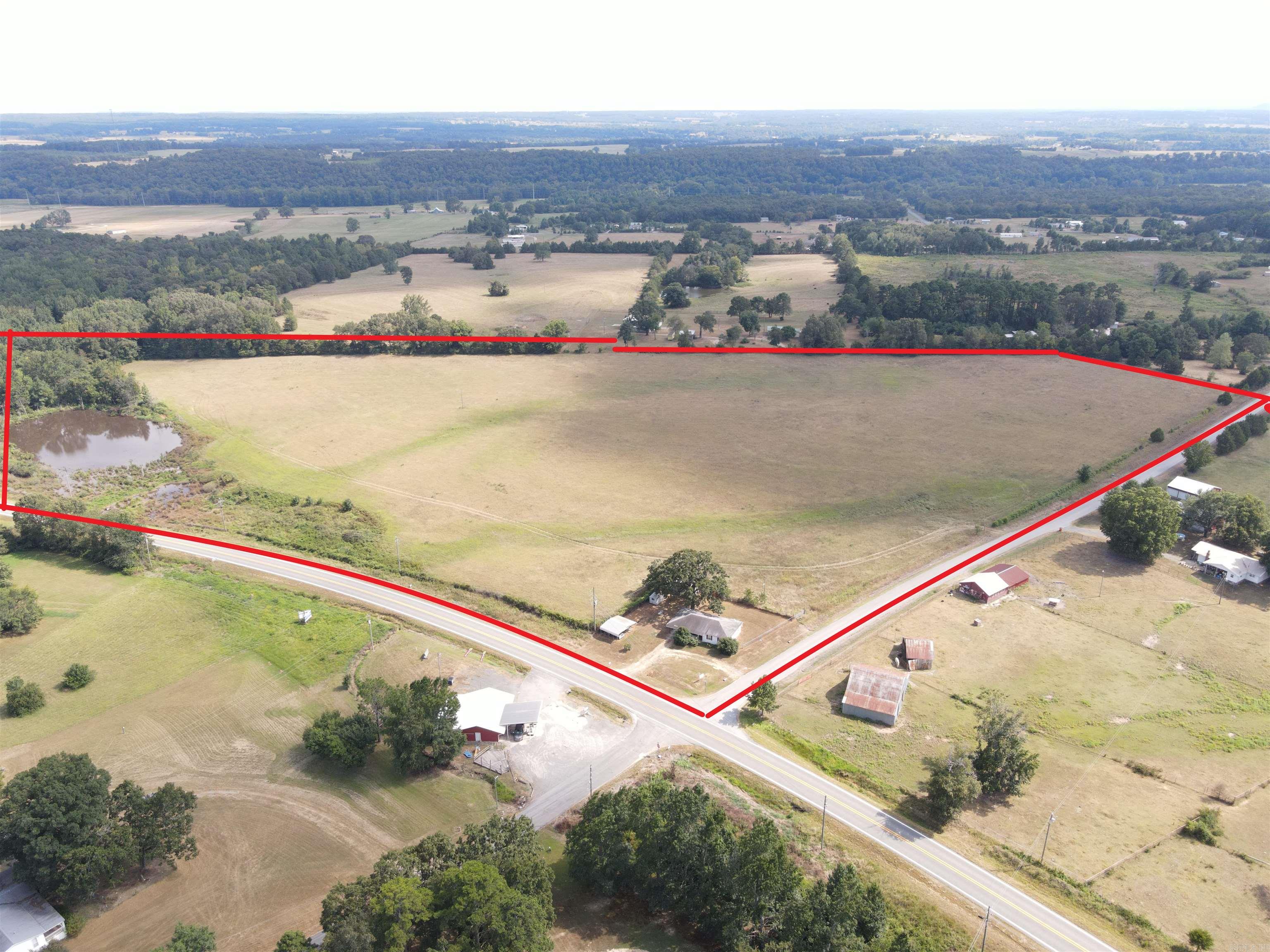 27.5 Acres of beautiful pasture ground at the corner of Highway 16, Wesley Chapel Road and Cove Creek Road. 3 miles from Greers Ferry Lake, this could easily be a small subdivision, a beautiful hay field, a great homesite a commercial site, storage units or whatever you can dream. There is electricity and community water available. There is highway frontage on two sides with a gravel partially on the third side. There are signs midway on Highway 16 and on Wesley Chapel Road.