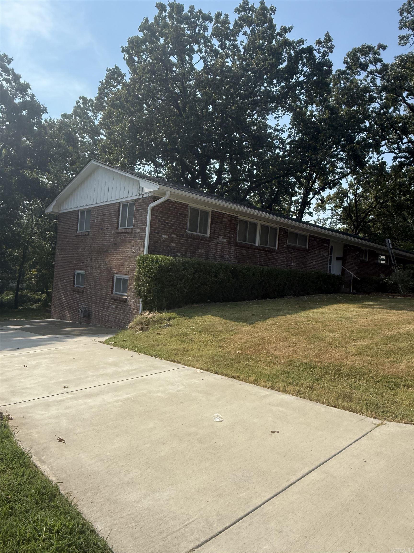 This Beautiful brick home in Park Hill is sitting on a large 0.25 lot and is located on the corner of N.Cedar and Garland Ave. This home has many, many updates and is move in ready!!! This home has a basement that goes out to the backyard and has a private driveway to it. It also has a large carport and parking on the other end of the home with a storage building. This beautiful interior is bright and airy with new paint, new cabinets, new bathrooms, great laundry room and the basement has been finished out with new split unit. Nice open bar in kitchen. You must see this home to appreciate all the features. Call for your appointment today. Pictures coming tomorrow.