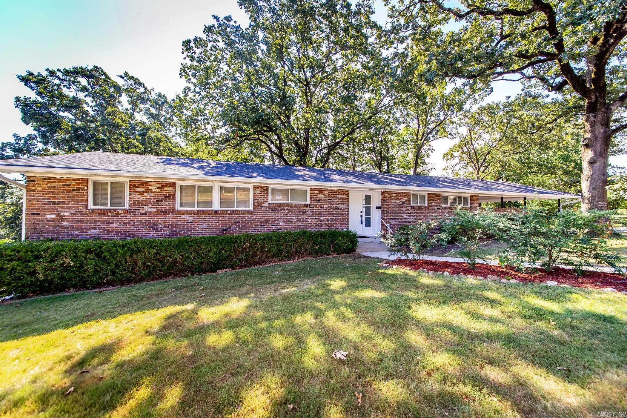 This Beautiful brick home in Park Hill is sitting on a large 0.25 lot and is located on the corner of North Cedar and Garland Ave. This home has many, many updates and is move in ready!!! This home has a basement that goes out to the backyard and has a private driveway to it. It also has a large carport and parking on the other end of the home with a storage building. This beautiful interior is bright and airy with new paint, new cabinets, new bathrooms, great laundry room and the basement has been finished out with new split unit. Nice open bar in kitchen. You must see this home to appreciate all the features. Call for your appointment today.