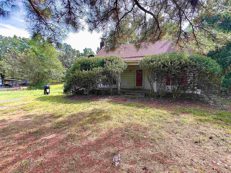 Remodeler’s Dream in the Heart of Cabot! This 3-bedroom, 2-bathroom home is ready for a fresh update and new owners to bring it back to life. Full of character and potential, the living room showcases soaring vaulted ceilings with exposed beams and a beautiful stone wood-burning fireplace. The dining room features original built-ins and large windows, while French doors add charm and natural light throughout. An oversized laundry/mudroom and abundant storage provide practicality for everyday living. Situated on 1.85 acres with a fenced backyard and a shop, this property offers both convenience and room to spread out. Located in a desirable residential area, it’s the perfect opportunity for remodelers and visionaries to transform this house into a stunning home once again.  This home is sold as-is. AGENTS SEE REMARKS.