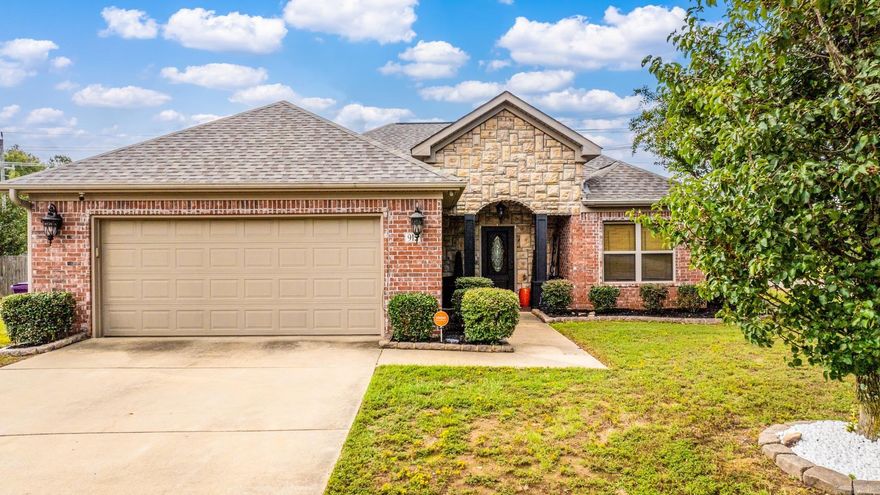 This is a lovely 4 bed 2.5 bath on an oversized corner lot in convenient Carmichael Estates, just minutes from both Bryant Junior High School and Bryant High School. From the cozy front porch, you are welcomed into the  open main living area with an electric fireplace. The kitchen has a large island with bar seating, lots of counter space, and granite countertops. Step out onto the deck and enjoy the large back yard enclosed with a new fence. There are three bedrooms and a full bath on one side of the living area and set apart on the other side is the spacious primary suite with a large jetted tub, double vanity, and walk-in closet. Conveniently located near the primary suite is the laundry room and two car garage with a stained concrete floor.  New fence + New roof installed in 2025.