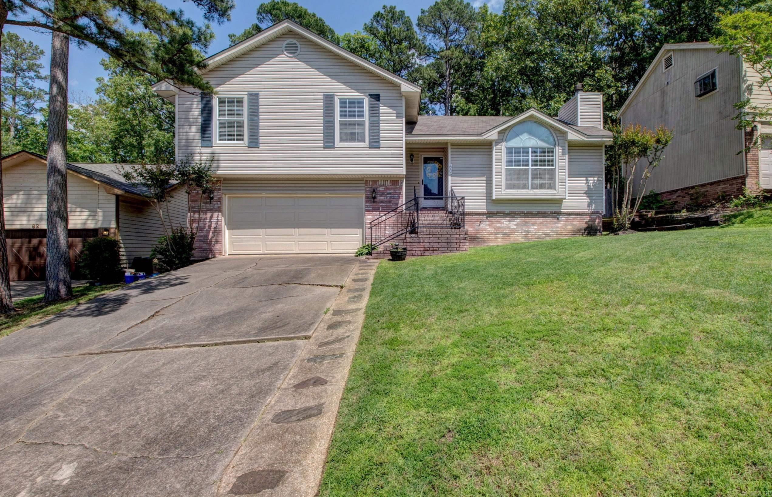Great Traditional 3 Bedroom, 2 Bath home! Great-room features a vaulted ceiling with a cozy wood burning gas fireplace you will love the Bonus room downstairs. In 2022 most major appliances had been replaced within last 5 years and roof is 2014 recently inspected with no issues. Seller replaced Garage Door, added a new oven and added a vapor barrier in the crawl space! Relax on the huge fenced in backyard with two relaxing patios.