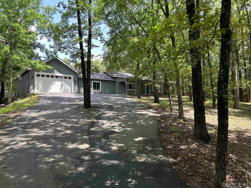 Buyer's remorse mixed with Mother Nature is your opportunity! Was scheduled to close on 6/15; hail storm on 6/14 caused minor damage to roof spooking the first time buyer from closing at all even though roof is being replaced. Seller is in process of having roof replaced now. A fantastic opportunity, this home features a charming interior and comprises generous living spaces and a cozy stone woodburning fireplace. Remodeled in 2015 with new appliances, windows/doors, and roof. Pristine well-maintained gleaming hardwood floors throughout. Enjoy this well-equipped kitchen that has been beautifully updated and features concrete countertops. Relax in the wonderfully secluded suburban getaway that features a wide porch. Lots of space for gatherings and outdoor entertaining. Sparkling and airy, the primary bathroom exudes a walk-in shower and a soaking tub. Conveniently set in a quiet neighborhood and part of the highly regarded Lake Hamilton schools. Don't miss out on owning this fabulous home. AC / Heat pump updated 2021.  Home is all electric except for stove which is propane (100 lb tank). AGENTS SEE REMARKS!