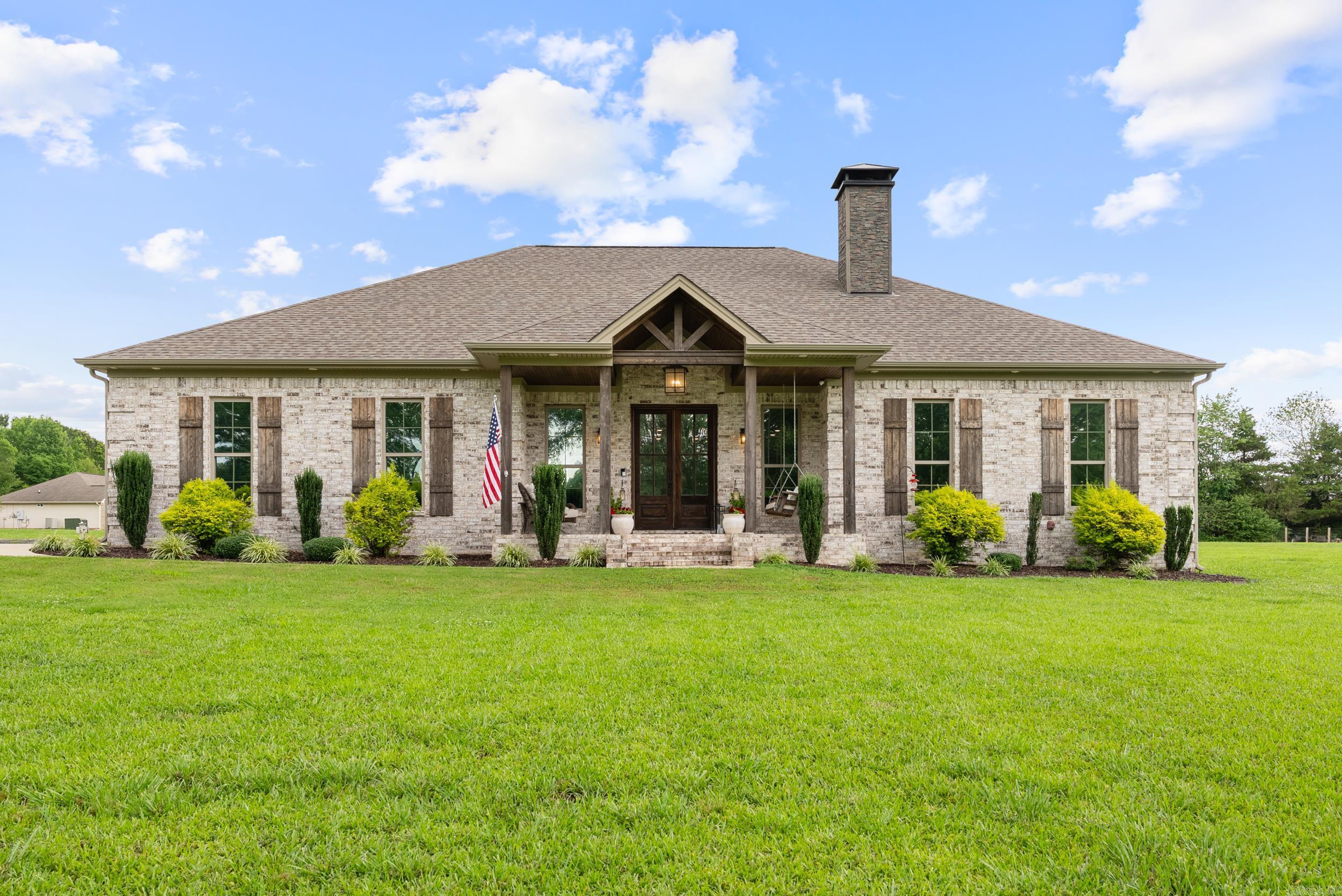 Welcome to your dream home, a stunning property built in 2020! Nestled on a spacious 2.18-acre all-brick estate. The heart of the home is its gourmet kitchen, featuring custom cabinets, quartz countertops, and a dedicated coffee bar area. For hobbyists or those needing extra storage, a spacious 1,000 sq ft shop provides ample space for all your needs. Outdoors, enjoy an above-ground pool with an adjoining fireplace for relaxation and entertainment, while inside, the wood-burning fireplace equipped with gas logs ensures a cozy ambiance throughout the seasons. Modern conveniences include a tankless hot water heater and a gas range, while the home is pre-wired for whole-home audio, ensuring the ultimate entertainment experience. The thoughtful layout includes his and hers closets in the master suite, a mother-in-law suite with a private door to the back patio, a dedicated home office at the front of the house, and a storm shelter for peace of mind. The elegant laundry room features a tiled accent wall, and the exterior design is highlighted by beautiful wood beams that add character and charm. Experience the best of modern living with this residenceāschedule your showing today!
