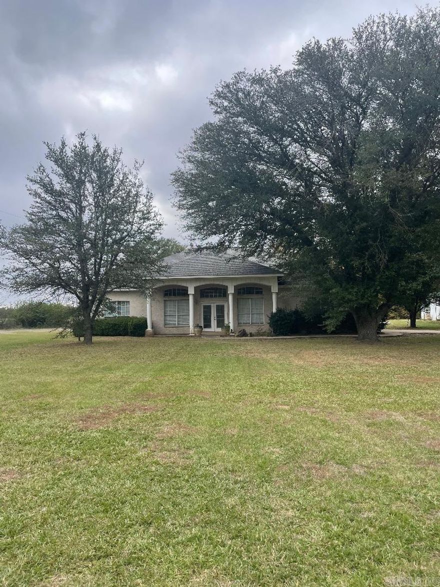 Come make this lovely  home your own!  Plantation style large columns in the front.  This home has 4 beds, 3.5 baths, 2 living areas, large master suite.  The kitchen has an open concept to the living and dining areas. There is an in ground pool, gazebo,  stone walk way around the pool, also a pool house that is equipped for a rental if desired, or mother-n-law house!