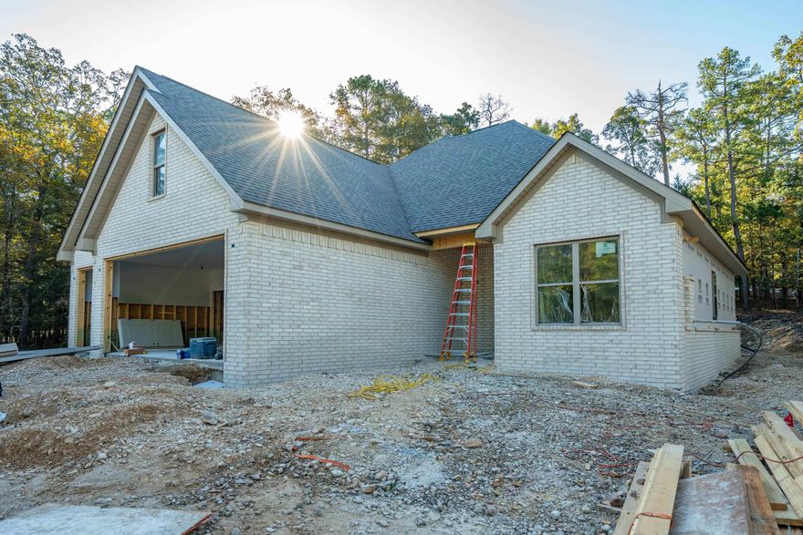 New Construction Near Ponce de Leon Golf Course! Projected for completion in December or January, this beautiful 3-bedroom, 2.5-bath home offers modern style and comfort in an unbeatable location—right across the street from the course. The open living area features vaulted ceilings, a cozy gas fireplace, and a stunning kitchen with quartz countertops, a walk-in pantry, and gas range. The primary suite also boasts vaulted ceilings, a soaking tub, and a spacious walk-in shower. Additional highlights include a dedicated office, stairs to a floored attic for extra storage, and luxury vinyl plank flooring throughout. Enjoy a 2-car garage plus an additional golf cart stall—perfect for village living.