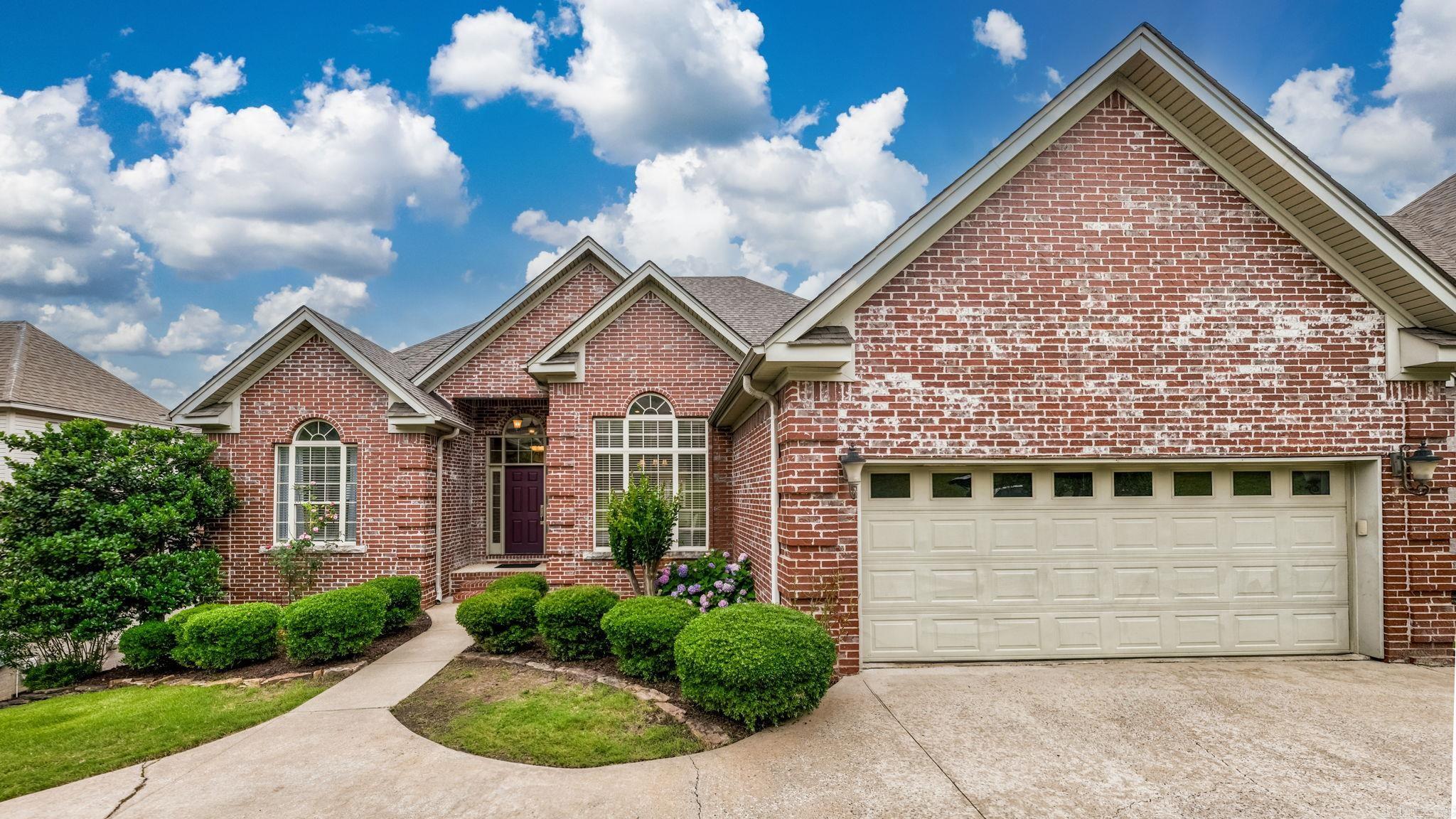 This home is a gem in the highly desired neighborhood of Villages of Wellington in West Little Rock. Beautifully updated throughout with plenty of room for all of the family and friends you wish to join you! The primary suite and 3 bedrooms or 2 bedrooms and an office plus two living areas, an eat-in kitchen, a dining room and laundry room are all on the main level. The lower level contains a third living space plus an en-suite bedroom and another bedroom or office/storage area/workout room. The large & fully-fenced backyard backs up to an area full of trees and greenery. The upper deck has a gas line for the grill that conveys. The lower deck contains a hot tub with new pump and new exterior wood that conveys. *EV charger installed 2025 * Roof 2020 * Tankless Hot Water Heater 2025 * Nestled on a quiet street near the neighborhood's pool, playground, and tennis courts and super close to a stocked pond wonderful for fishing, this home has so much to offer! Schedule your private tour today!