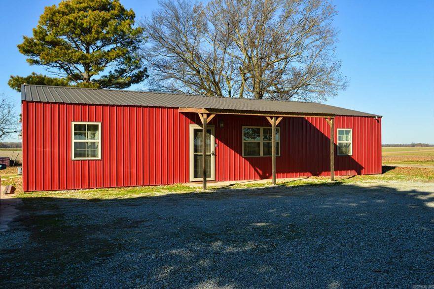 Experience the best of country living in this barndominium-style home built in 2022. Set on nearly an acre just outside Swifton, This property combines rustic charm with modern finishes. The open layout showcases stained concrete floors, a spacious kitchen with stainless steel appliances, a large island, and a sleek designer range hood that makes a striking centerpiece. The primary suite offers a walk-in closet, double vanities, and a custom tiled shower. Step outside to enjoy the screened-in porch, perfect for relaxing or entertaining, and take comfort in the in-ground concrete storm shelter. This home delivers both convenience and peace of mind in a beautiful country setting. With access to local hunting on Shirey Bay Rainey Brake WMA