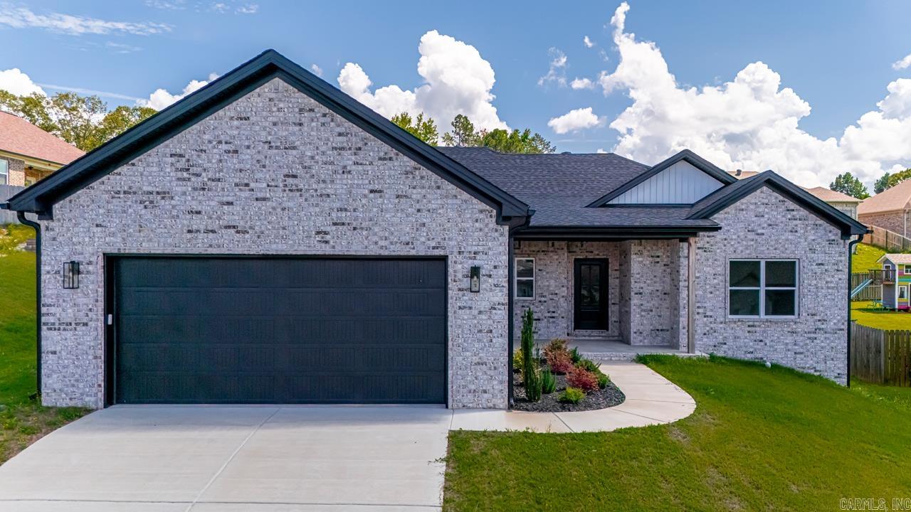 Welcome to your cozy new home! This delightful 3-bed, 2-bath, 1,830 sq. ft. home is nestled just 5 minutes from I-30, offering easy access to shops and schools. Imagine relaxing in the open layout with its inviting 9-foot ceilings. The heart of the home is the kitchen, featuring a handy island and custom cabinets. You'll love the easy-care LVP flooring throughout the main living areas. The primary suite is a true retreat, complete with a stylish bathroom featuring a tile shower and a luxurious free-standing tub. Step outside and unwind on the covered back porch. This home is waiting to welcome you!