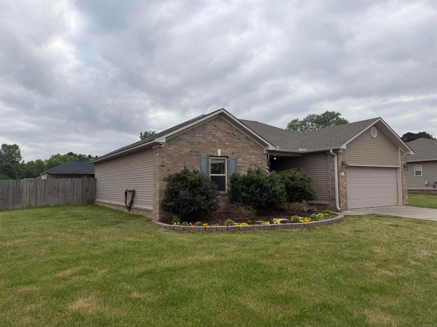 Welcome to this impeccably maintained 3-bedroom, 2-bathroom home designed for effortless living at every stage of life. Close to top-rated neighborhood schools, this home offers a thoughtful split-floor plan that maximizes privacy without sacrificing connection.  Stepping inside, you are greeted by an open-concept living area adorned with elegant crown molding and soaring trey ceilings. The heart of the home features a spacious kitchen with classic oak cabinetry, flowing seamlessly into the family room—ideal for hosting guests or visiting while you cook. Enjoy easy access from both the front door and the two-car garage.  Peace of Mind: Significant structural updates include a brand-new HVAC system (2024) and a roof replaced within the last five years.  Outdoor Oasis: The professionally landscaped yard is a gardener’s dream, featuring vibrant daylilies and a raised garden bed. The backyard retreat is complete with a sunken firepit, a patio illuminated by atmospheric Edison lighting, and integrated French drains for optimal maintenance.  This home combines timeless interior details making it a rare find in a prime location. Schedule your private showing. House is occupied.