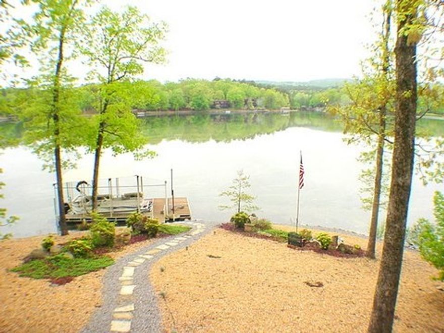 Beautifully updated & expanded, “Madrid” with Sunrise to Sunset views of Lake Cortez & Multi-Vista Views beyond. Easy walk to the 140 ft. of Shorefront. Lake Views from Great Room Native Stone Fireplace, Screened Porch, Open Deck & AR Room. Up-dated eat-in island kitchen features, double ovens, Corian Counters, Hard Woods & huge, Pantry /Craft/Storage area.Stunning AR Room with a full wall of windows. Lower level sports a Pine Pool Room/Man Cave +  adjacent Office + full bath.Covered Boat Dock.