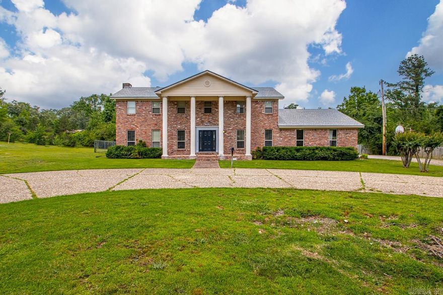 New Roof-2024: 40 year architectural shingles. Spacious living area has hardwood floors and wet bar. The home features a nice kitchen with tile and granite, pantry, wall oven, and cook top as well as a nice island area. Formal dining off of the kitchen has wood floors and french doors. Home sits on 2.78 acres. This is a great rare find in city limits! A must see!